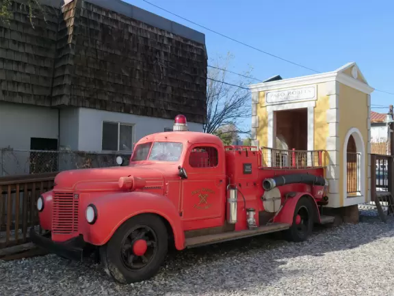 Attractive children's museum with market and carts, Newton's playhouse where you can shoot balls, ball pit, fire engine, oak tree tunnels, stage, dress-up area, and pizza kitchen.