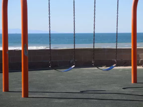 Lovely cove, grassy hills, Spanish galleon ship, playground, walkway out to the point, rocky jetties, and modern beachhouses!