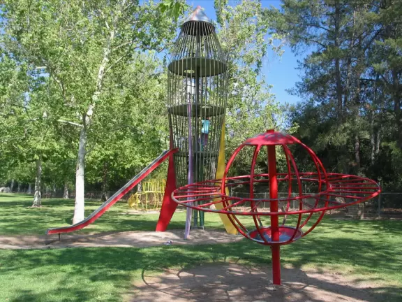 Huge park with large shady lawns, trippy playground equipment, and gorgeous mountain views.