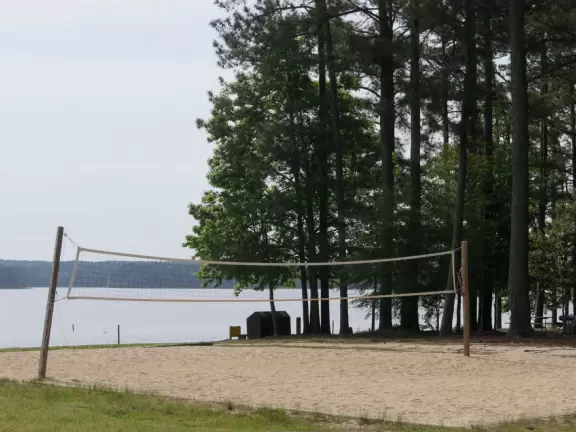 Peaceful&nbsp;spot with nice sand (great for building), blue water (from a distance), the sound of water lapping the shore, green lawn, playground, and trees for shade.