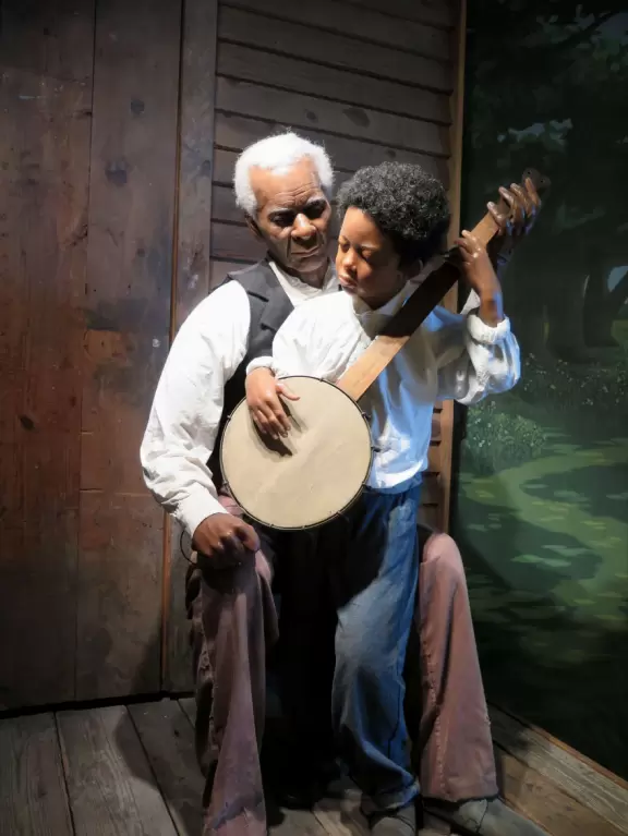 Nice two-storey museum with well-told history of banjo on lit-up porch, beautiful banjos displayed, and front room where you can play a banjo!