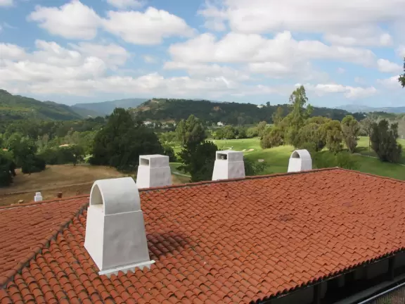 Spanish buildings and hillside. 