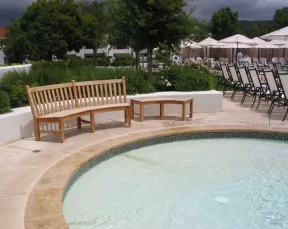 A magical place set upon hills with huge majestic oaks, shimmering green lawns, and exquisite Spanish architecture and decor, all backed by Ojai's mountains.