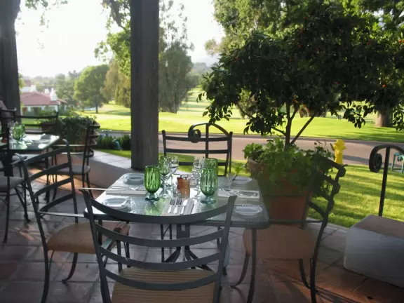 A magical place set upon hills with huge majestic oaks, shimmering green lawns, and exquisite Spanish architecture and decor, all backed by Ojai's mountains.