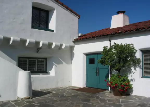 A magical place set upon hills with huge majestic oaks, shimmering green lawns, and exquisite Spanish architecture and decor, all backed by Ojai's mountains.