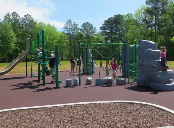 Large&nbsp;playground with dinosaur bouncy, stepping stones,&nbsp;zipline and more!