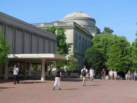 Historic buildings, sunny quad where students hang out, flowers and old trees, and fun student center area.