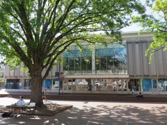 Historic buildings, sunny quad where students hang out, flowers and old trees, and fun student center area.