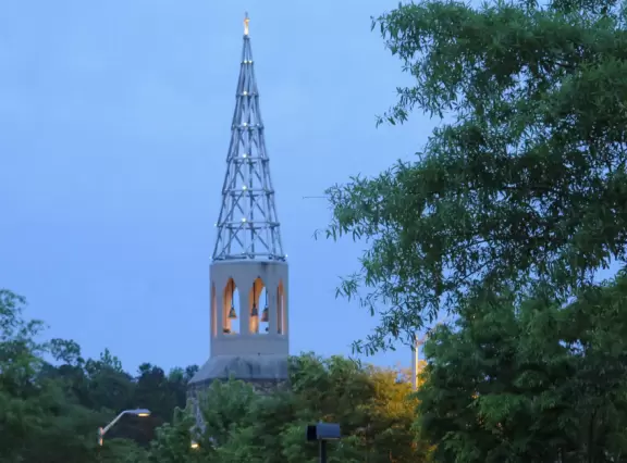 Cute area with outdoor cafes, flower boxes, church steeple with chimes, and village green&nbsp;where family events such as movie night or games night are held.