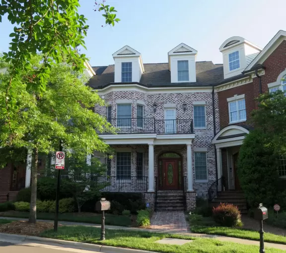 Gorgeous one-mile greenway or bike path with shady forest, flowers, little hills, and pond with fountain.
