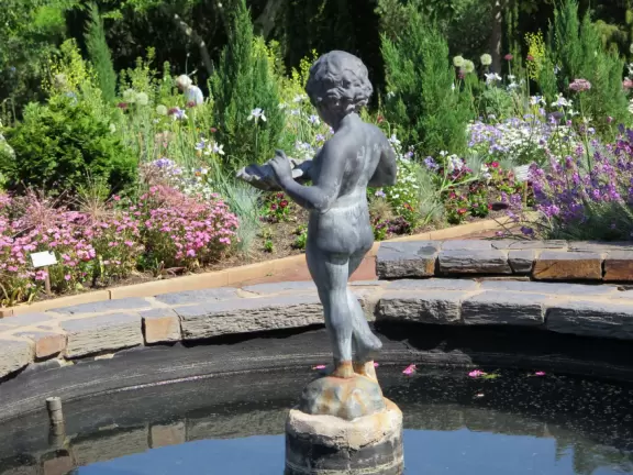 Large world-class garden with lakeside allees, flower terraces, and small Japanese garden.