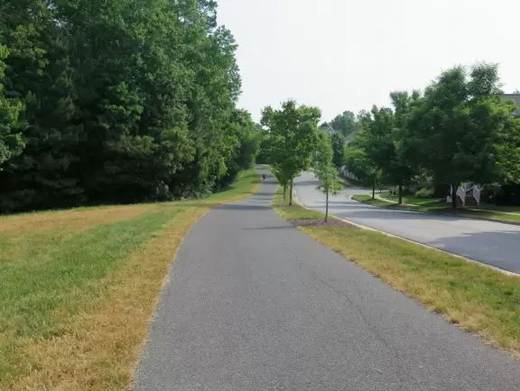 2.4 mile paved, intermittently shady greenway with varied sights!