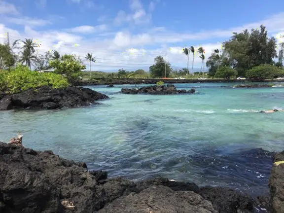 Beautiful lagoon with a little sandy cove, plus a rocky entrance with metal stairs. Cold water!
