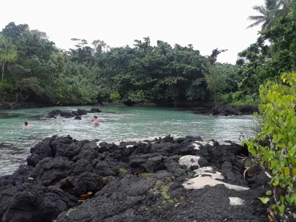 Beautiful lagoon with a little sandy cove, plus a rocky entrance with metal stairs. Cold water!