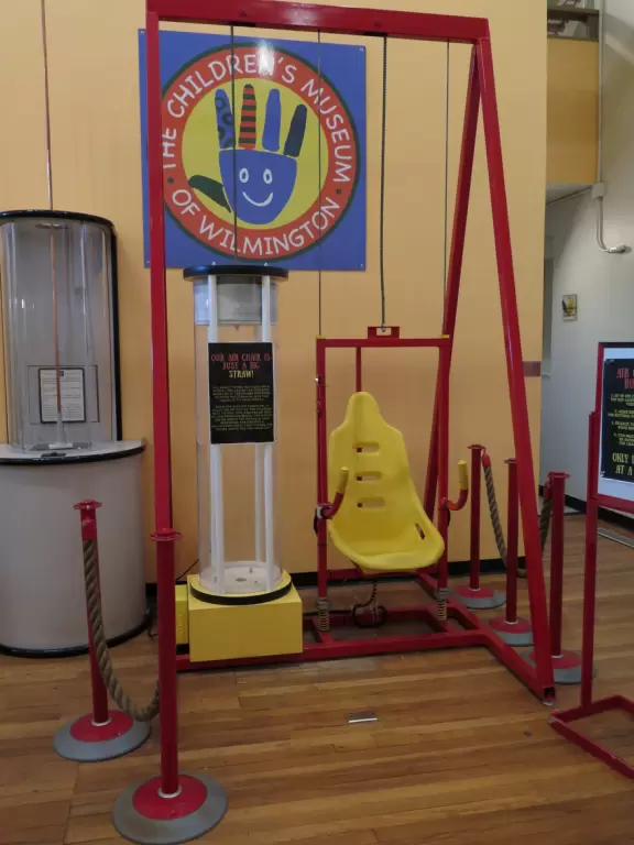 Large children's museum with ship with cannons, play houses, market and diner.