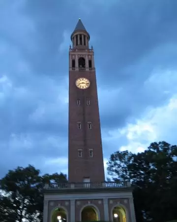 Historic buildings, sunny quad where students hang out, flowers and old trees, and fun student center area.