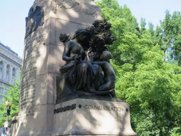 Busy area with activists, street musicians, and tourists checking out views of the White House.