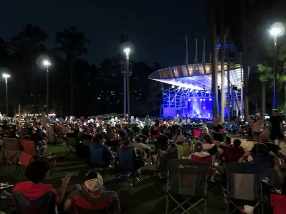 Concerts under the stars with tall pines reaching to the sky.