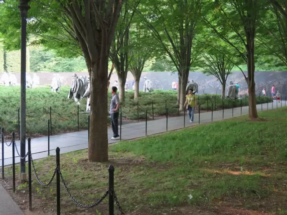 Memorial full of atmosphere, with statues of soldiers rising out of the juniper bushes.