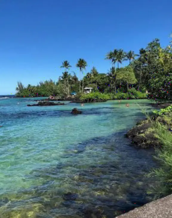 Beautiful lagoon with a little sandy cove, plus a rocky entrance with metal stairs. Cold water!