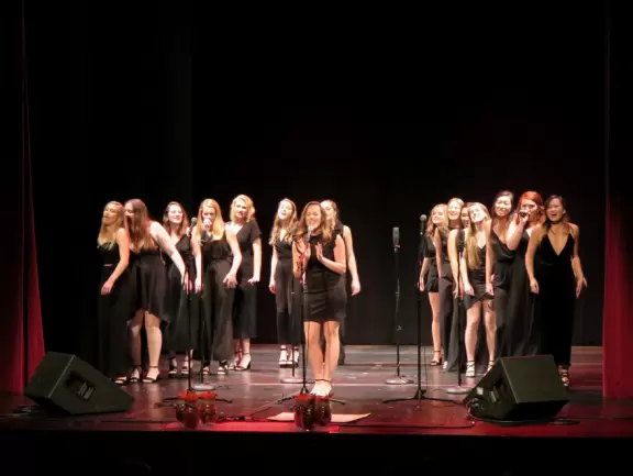 Historic buildings, sunny quad where students hang out, flowers and old trees, and fun student center area.