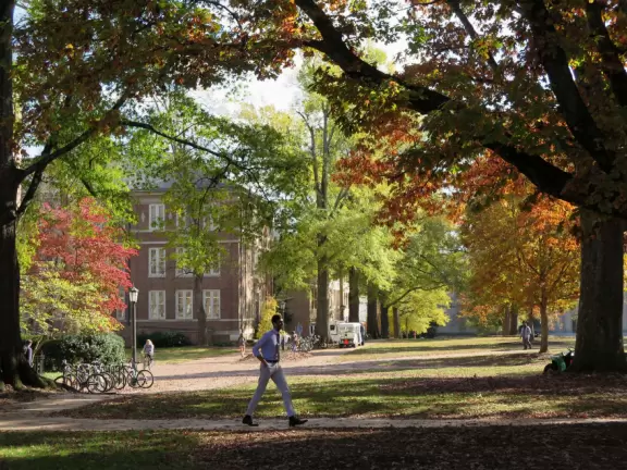 Historic buildings, sunny quad where students hang out, flowers and old trees, and fun student center area.