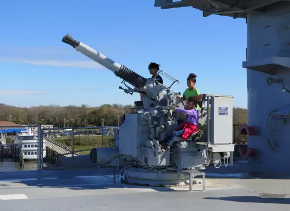 Beautiful bright harbor views from this huge aircraft carrier!