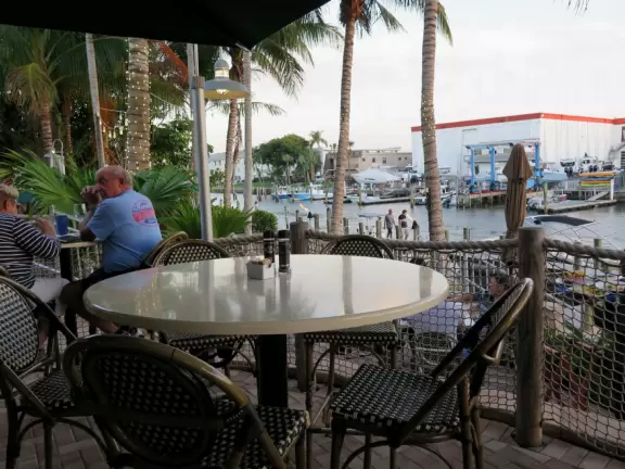 Pretty park along the intracoastal waterway near high rises, with walking paths, playground, gazebos, fountain, and tennis courts.