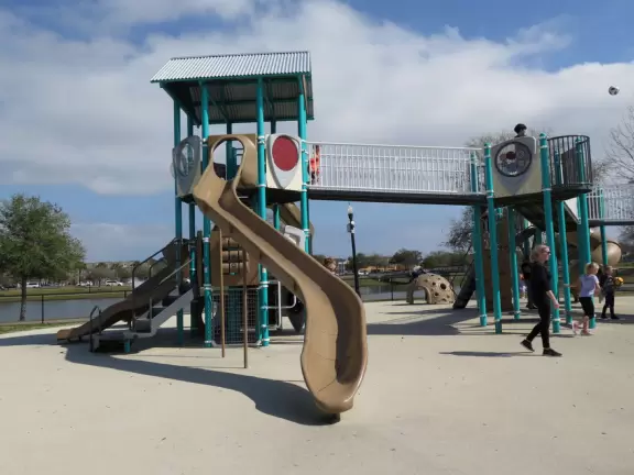 Amazing playground in a lovely park with a small lake.