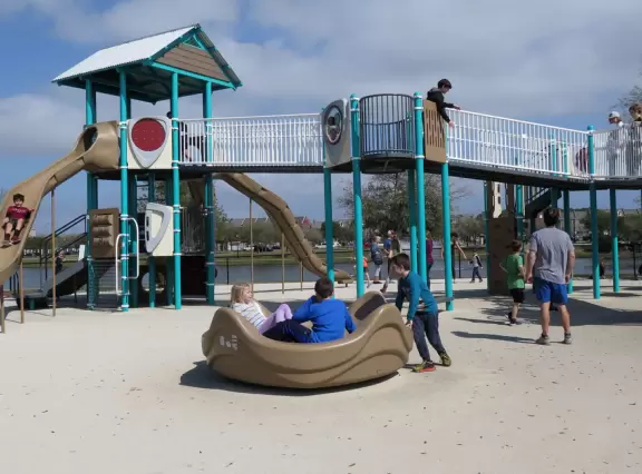 Amazing playground in a lovely park with a small lake.