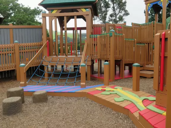 Amazing playground with everything a kid could want, plus gorgeous views of green hills.