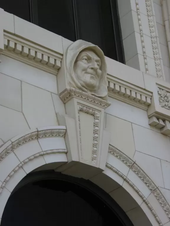 Regal building fronted by palms and flowers atop a pretty hill in downtown Ventura.