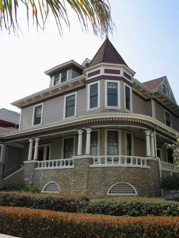 Regal building fronted by palms and flowers atop a pretty hill in downtown Ventura.