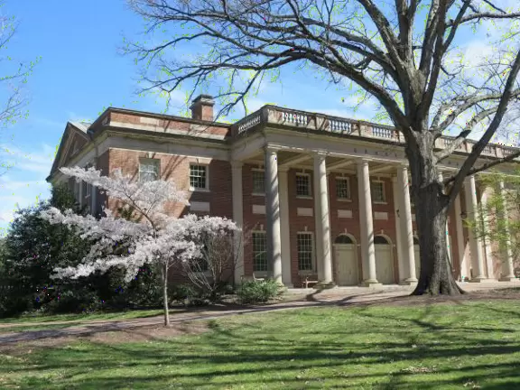 Historic buildings, sunny quad where students hang out, flowers and old trees, and fun student center area.