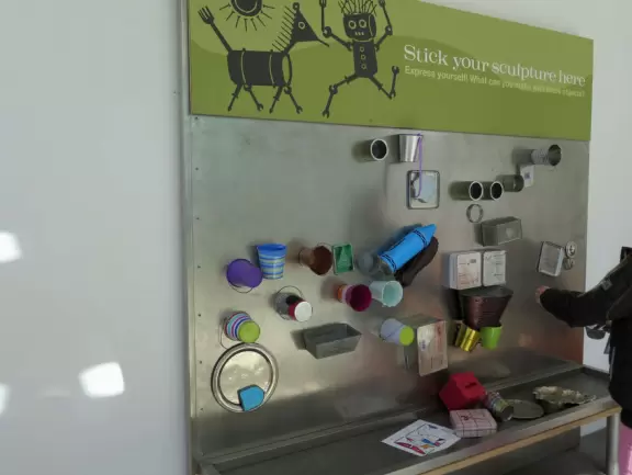 Incredible glass building with interesting activity stations for kids and modern art for parents.