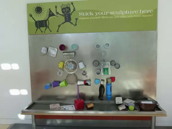 Incredible glass building with interesting activity stations for kids and modern art for parents.