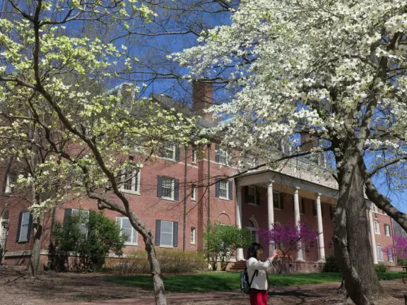 Historic buildings, sunny quad where students hang out, flowers and old trees, and fun student center area.