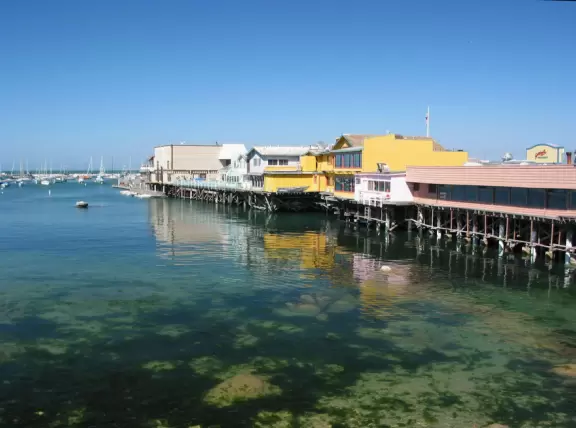Touristy wharf with souvenir shops, mediocre restaurants, but gorgeous blue-green water and sometimes seals swimming by!