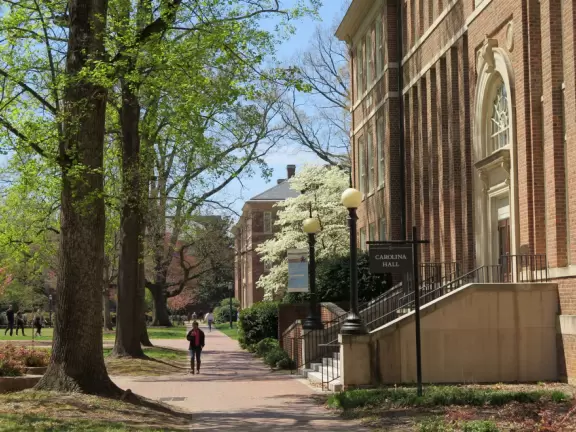 Historic buildings, sunny quad where students hang out, flowers and old trees, and fun student center area.