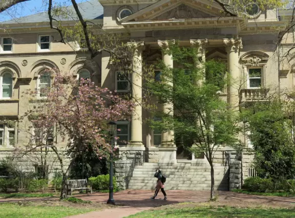 Historic buildings, sunny quad where students hang out, flowers and old trees, and fun student center area.
