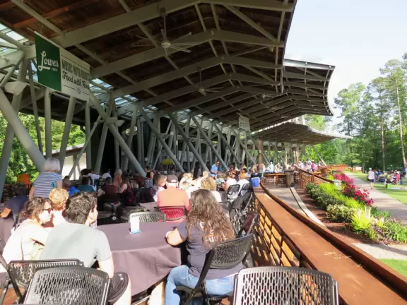 Concerts under the stars with tall pines reaching to the sky.