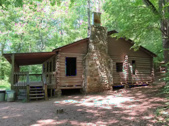 Pretty area with flowing river, rocks to play on, forest and flowers, and swinging bridge.