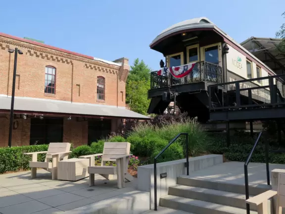 Unique redevelopment complex with man-made river, bee hive behind glass, colorful decorations, live music, and a few restaurants.