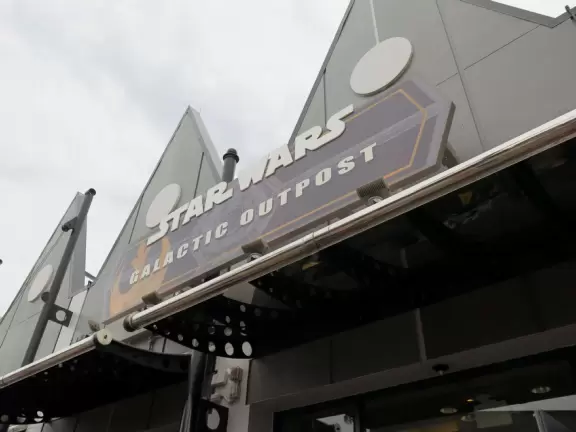 Waterfront area with restaurants, live street performers, entertainment, toy stores, and carousel.