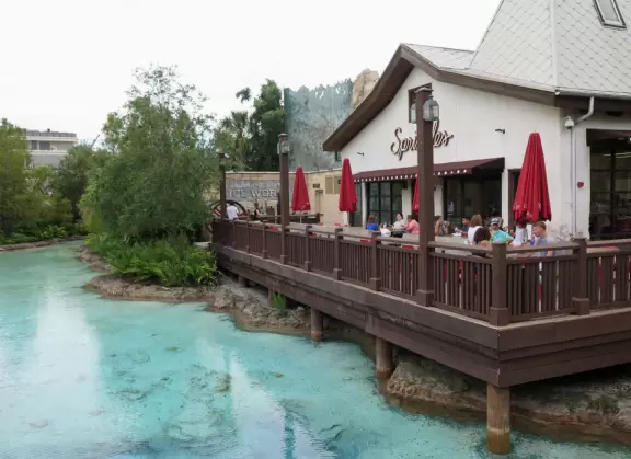 Waterfront area with restaurants, live street performers, entertainment, toy stores, and carousel.