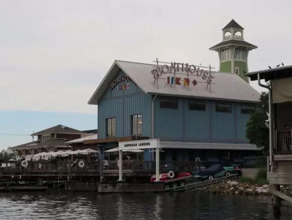 Waterfront area with restaurants, live street performers, entertainment, toy stores, and carousel.