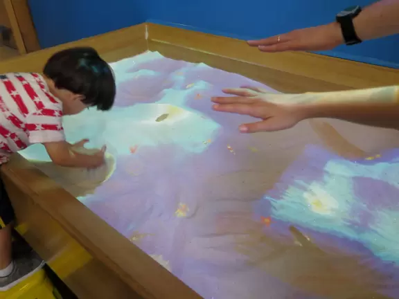 Super children's museum with rope climbey, music station, dance area, lincoln logs, magnetic triangles, sand that responds, supermarket, and more!