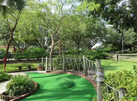 Beautiful mini golf with waterfalls, caves, pirate ship, tropical landscaping, and lots of shade.