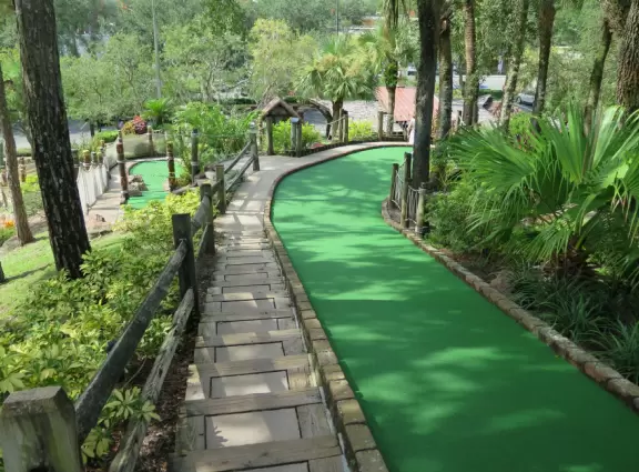 Beautiful mini golf with waterfalls, caves, pirate ship, tropical landscaping, and lots of shade.