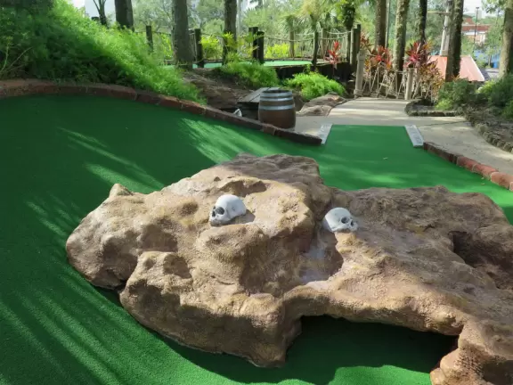 Beautiful mini golf with waterfalls, caves, pirate ship, tropical landscaping, and lots of shade.
